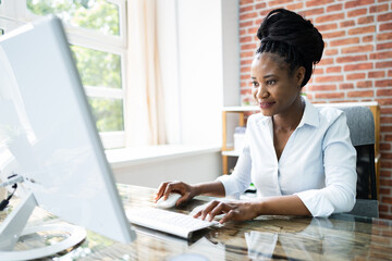 Happy Professional Woman Employee Using Computer