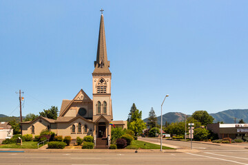 Newman United Methodist Church in downtown Grants Pass. The evolving rainbow flag above the...