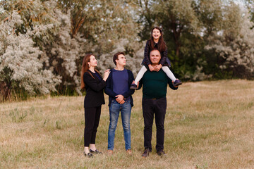 Fototapeta premium Children are teenagers and middle-aged father in the summer.