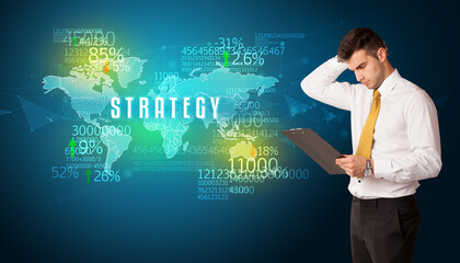 Businessman in front of a decision with STRATEGY inscription, business concept