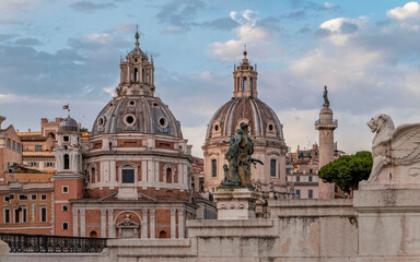 Fototapeta na wymiar golden hour in Rome Italy, view of Santa Maria di Loreto and palazzo Valentini domes from Venice square