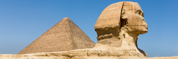 The pyramids at Giza in Egypt. Web banner in panoramic view.