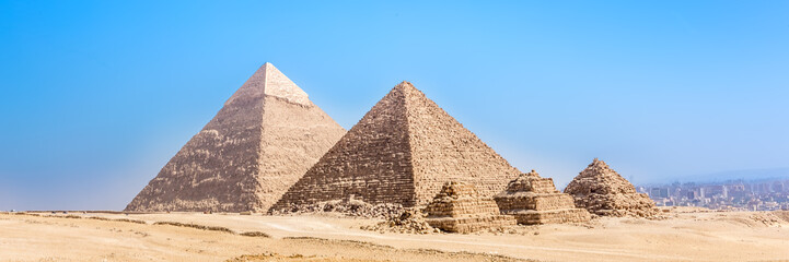 Fototapeta na wymiar The pyramids at Giza in Egypt. Web banner in panoramic view.