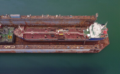 repair vessels hull  (ship, tanker) in shipyard