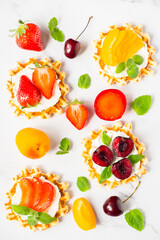 Top view of traditional Belgian waffles with soft cheese, fruits and berries. flat lay.