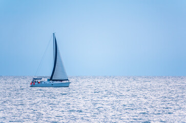 Obraz premium Sailing yacht in the blue calm sea.