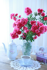 summer morning with the scent of roses and tea with milk