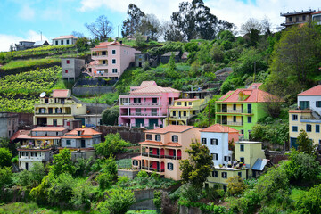 Fototapeta na wymiar Colorful houses of the small town Fontes, Madeira, Portugal.