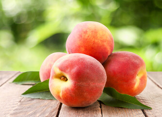 Pile of ripe peaches on nature background