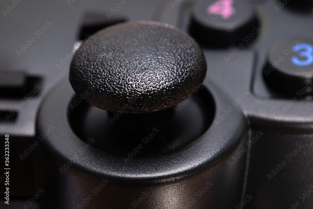 Poster black game joystick on white background close-up