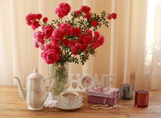 summer morning with the scent of roses and tea with milk