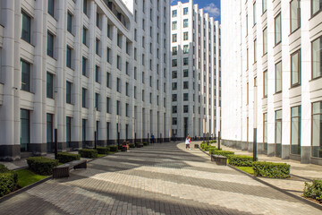 Modern white architectural buildings-offices and apartments in Moscow Russia large walkway and pedestrian sidewalk and space for copying