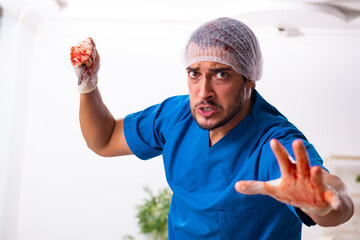 Young male doctor surgeon in fatal negligence concept