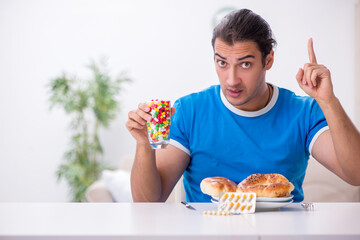 Young hungry man in dieting concept