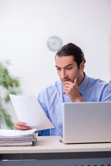 Young male employee in the office