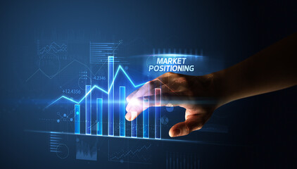 Hand touching MARKET POSITIONING button, business concept