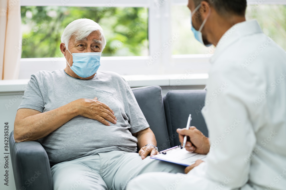 Wall mural doctor talking to elderly patient