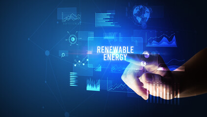 Hand touching RENEWABLE ENERGY inscription, new business technology concept