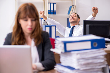 Two employees working in the office