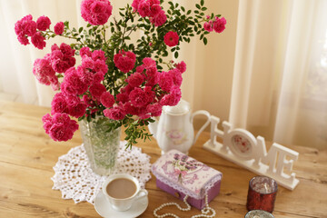 summer morning with the scent of roses and tea with milk