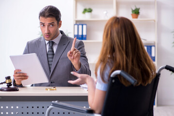 Young injured woman and male lawyer in the courtroom
