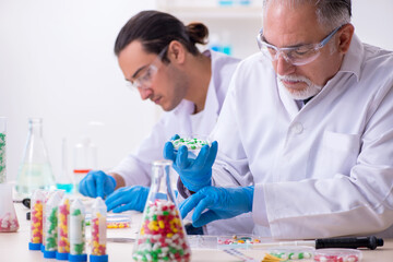 Two chemists working in the lab