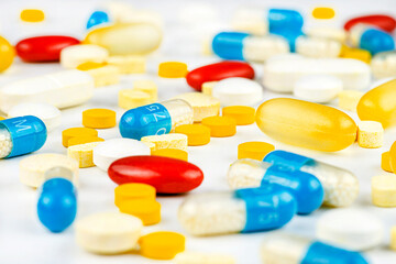Background made of different kinds of colorful pills and tablets, macro shot.