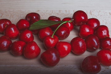 red cherries on a wooden table