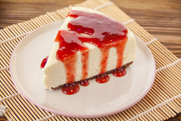 delicious cheesecake with strawberries on  plate