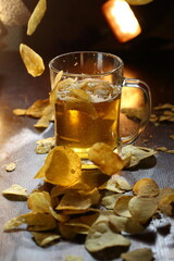 Chips and beer on a wooden table
