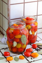 Tomatoes in glass jars in brine
