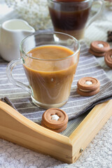 Morning Cup of cappuccino and cookies on a tray