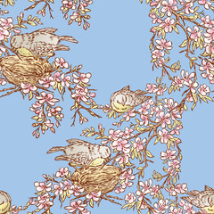 Seamless background of birds nesting on blooming cherry tree
