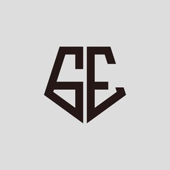 G E black pentagon initials with a gray background