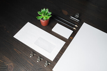 Blank branding identity set on wooden background. Corporate stationery template. For design presentations and portfolios.