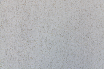 Texture of the white wall with decorative plaster.