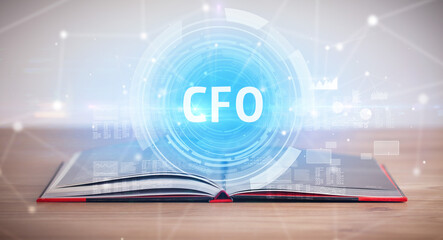 Open book with CFO abbreviation, modern technology concept