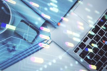 Multi exposure of data drawing hologram over topview of study desk background with computer. Concept of technology.