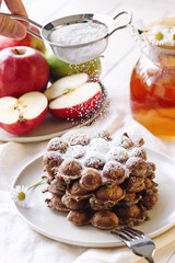 Gresh apple waffels with icing sugar and fresh apples breakfast
