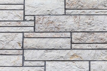 Granite white stone block walls pattern and seamless background