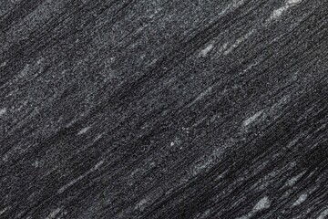 Texture and Seamless background of black granite stone