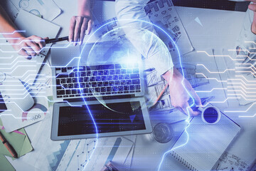 Double exposure of man and woman working together and brain drawing hologram. Intellectual brainstorming concept. Computer background.