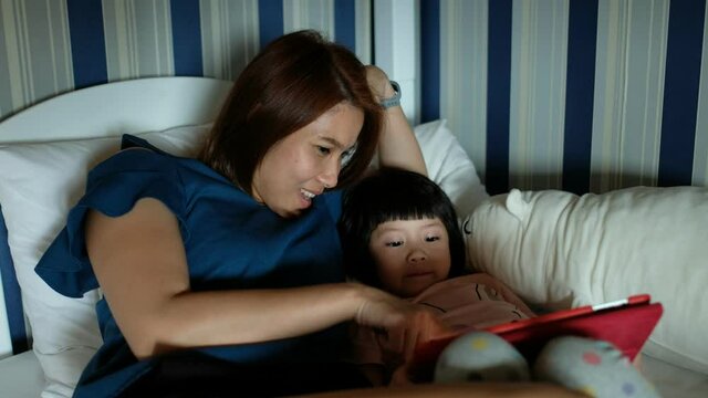  child playing smartphone with mother, kid addicted tablet
