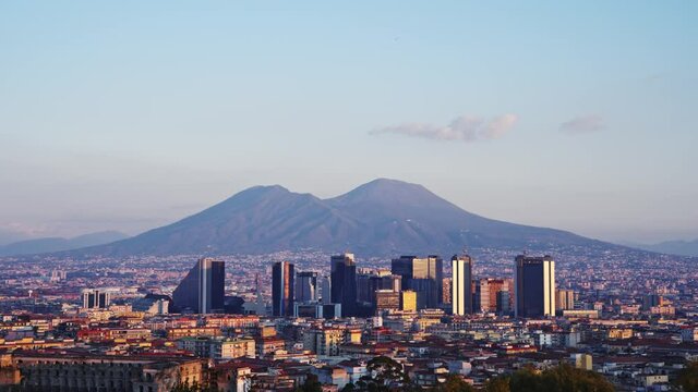 Panorama of Naples and Mount Vesuvius in Italy, time-lapse, aerial view of centro direzionale, downtown skyscrapers, volcano background