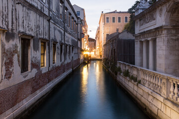 Fototapeta na wymiar Narrow canal of Venice in Italy