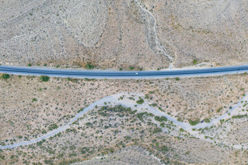 An aerial view shows a road running through the desert surrounding Las Vegas, Nevada. This desert area averages over 95 degrees F during summer months.