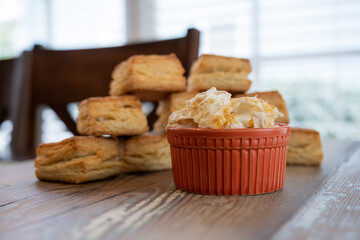 Clotted Cream in Orange Dish With Biscuits