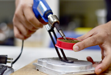 Computer maintenance technician repairing Electronic equipment and computer components, Selective focus.