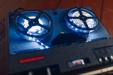 reel to reel audio tape recorder with blue led light strip
