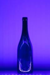 abstract empty wine bottle with violet led illumination